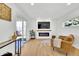 Relaxing living room with a fireplace, sliding glass doors, and comfortable seating at 2725 S Monroe St, Denver, CO 80210