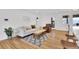 Bright living room with hardwood floors, modern furniture, and a stylish area rug at 2725 S Monroe St, Denver, CO 80210