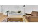 Cozy living area showcasing a comfortable couch, leather chair, and chic decor at 2725 S Monroe St, Denver, CO 80210