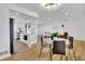 An open layout with a modern island kitchen and dining area, perfect for entertaining and everyday living at 2725 S Monroe St, Denver, CO 80210