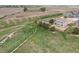 Aerial shot highlighting the home's location near open land, offering a sense of privacy and space at 1523 Honeysuckle Ct, Brighton, CO 80601