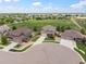 An elevated view showcases the home's position within a well-planned community with green spaces at 1523 Honeysuckle Ct, Brighton, CO 80601