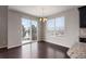 Bright dining room with sliding glass door offering winter views and plenty of natural light at 1523 Honeysuckle Ct, Brighton, CO 80601