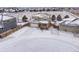 Beautiful two-story home with attached garage in a snowy neighborhood at 1523 Honeysuckle Ct, Brighton, CO 80601