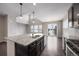Beautiful kitchen with granite countertops, stainless appliances, and eat in area at 1523 Honeysuckle Ct, Brighton, CO 80601