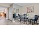 Cozy dining area features a glass table, stylish chairs, and a mirrored wall, enhancing the space at 9110 E Girard Ave # 1, Denver, CO 80231
