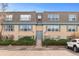 Exterior view of building featuring multiple units, blue shutters, and well maintained landscaping at 9110 E Girard Ave # 1, Denver, CO 80231