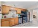 Kitchen featuring stainless steel appliances, wooden cabinets, and granite countertops at 9110 E Girard Ave # 1, Denver, CO 80231