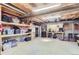 Unfinished basement with shelving and workshop area at 4861 Curie Ct, Boulder, CO 80301