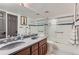 Clean bathroom with double vanity and a shower/tub combo at 4861 Curie Ct, Boulder, CO 80301