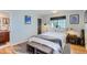 Well-lit bedroom with hardwood floors and ensuite bathroom at 4861 Curie Ct, Boulder, CO 80301
