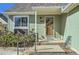 Inviting front porch with a wooden door and well-maintained landscaping enhances curb appeal at 4861 Curie Ct, Boulder, CO 80301