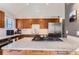 Kitchen showcasing granite countertops, stainless steel appliances, including fridge and cooktop on kitchen island at 4861 Curie Ct, Boulder, CO 80301