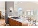Open concept kitchen and dining area with granite countertops, gas cooktop, and ample natural light at 4861 Curie Ct, Boulder, CO 80301
