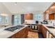 Spacious kitchen features wood cabinets, granite countertops, stainless steel appliances, and a gas cooktop at 4861 Curie Ct, Boulder, CO 80301