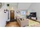 Living room with vaulted ceilings, hardwood floors and comfortable seating at 4861 Curie Ct, Boulder, CO 80301