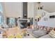 Spacious living room with a fireplace, hardwood floors and high ceilings at 4861 Curie Ct, Boulder, CO 80301
