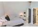 Large main bedroom with plush bedding and ensuite bathroom access at 4861 Curie Ct, Boulder, CO 80301