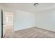 Inviting bedroom with soft carpeting, neutral walls, and an open doorway leading to other living spaces at 13832 Honey Hush Trl, Parker, CO 80134