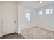 Cozy bedroom featuring neutral carpeting, white walls, and natural light at 13832 Honey Hush Trl, Parker, CO 80134