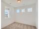 Comfortable bedroom with plush carpeting, three windows, and neutral decor for a tranquil retreat at 13832 Honey Hush Trl, Parker, CO 80134