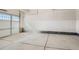 Clean, spacious two car garage with a carriage style door and concrete floor at 13832 Honey Hush Trl, Parker, CO 80134