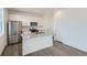 Modern kitchen with stainless steel appliances, granite countertops, and a center island for extra prep space at 13832 Honey Hush Trl, Parker, CO 80134