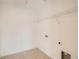 Utility room with washer/dryer hookups and a shelf for storage at 13832 Honey Hush Trl, Parker, CO 80134