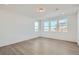 Bright, open living room with large windows offering ample natural light and scenic neighborhood views at 13832 Honey Hush Trl, Parker, CO 80134