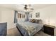 Stylish bedroom with a queen-sized bed, soft lighting, and scenic views at 6719 W 70Th Ave, Arvada, CO 80003