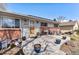 Inviting front porch featuring a seating area, decorative plants, and a beautiful wooden front door at 6719 W 70Th Ave, Arvada, CO 80003