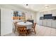 Bright eat-in kitchen with tile flooring, a large window, and a cozy breakfast nook at 6719 W 70Th Ave, Arvada, CO 80003
