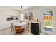 Eat-in kitchen with tile flooring, natural light, and access to the backyard at 6719 W 70Th Ave, Arvada, CO 80003