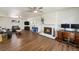 Bright living room with hardwood flooring, fireplace, and stylish furniture at 6719 W 70Th Ave, Arvada, CO 80003