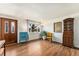 Bright living room with hardwood floors, a large window, and tastefully selected décor at 6719 W 70Th Ave, Arvada, CO 80003