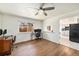 Home office with hardwood floors, abundant natural light, and an open view to the kitchen at 6719 W 70Th Ave, Arvada, CO 80003