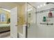 Full bath with updated shower stall and bath tub with hand rails at 15222 E Batavia Pl, Aurora, CO 80011