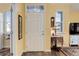 Inviting entryway with decorative glass accent window above the front door at 15222 E Batavia Pl, Aurora, CO 80011