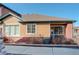 Inviting exterior view with brick accents, large windows and manicured landscaping at 15222 E Batavia Pl, Aurora, CO 80011