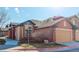 Charming home featuring a well-manicured lawn and a two-car garage at 15222 E Batavia Pl, Aurora, CO 80011