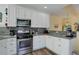Modern kitchen with stainless steel appliances and sleek backsplash at 15222 E Batavia Pl, Aurora, CO 80011