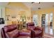 Open concept living room leading into dining room with view of bathroom at 15222 E Batavia Pl, Aurora, CO 80011
