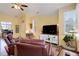 Bright and inviting living room featuring large windows and modern decor at 15222 E Batavia Pl, Aurora, CO 80011