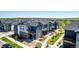 Elevated view of townhome neighborhood showcasing manicured lawns and convenient garage access at 157 Ambrose St, Erie, CO 80516