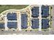 Aerial view of townhomes with manicured landscaping and walking paths at 157 Ambrose St, Erie, CO 80516