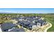 Aerial view of two story modern townhomes with gray and white siding at 157 Ambrose St, Erie, CO 80516