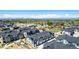 View of gray and white townhomes with mountains in background at 157 Ambrose St, Erie, CO 80516