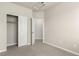 Neutral bedroom with sliding closet doors and carpeted floors at 157 Ambrose St, Erie, CO 80516