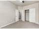 Neutral bedroom with sliding closet doors and carpeted floors at 157 Ambrose St, Erie, CO 80516