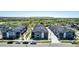 Street view of modern townhomes with neutral exterior paint and landscaping at 157 Ambrose St, Erie, CO 80516